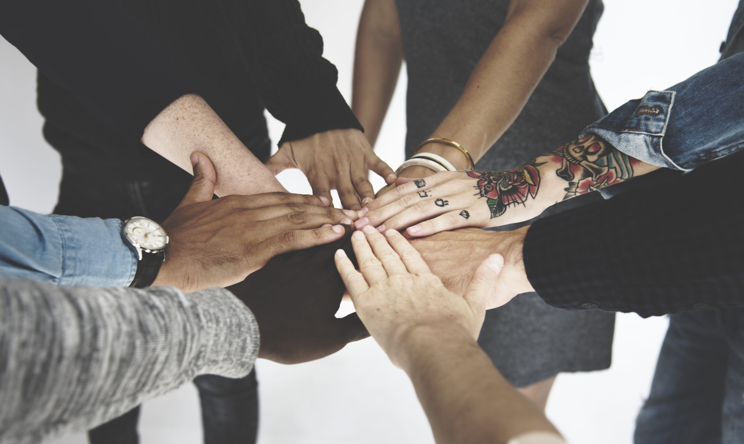 Hands together in a team huddle
